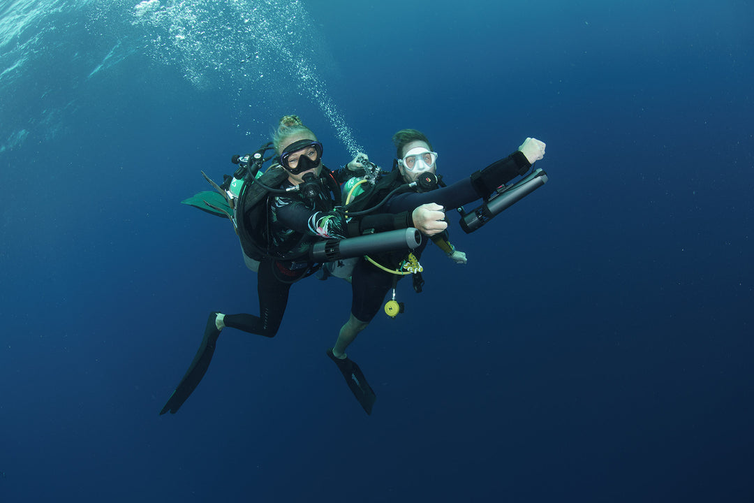 Friends have fun with subnado underwater scooter